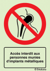 Signal d´interdiction, accès interdit aux personnes munies d´implants métalliques avec texte